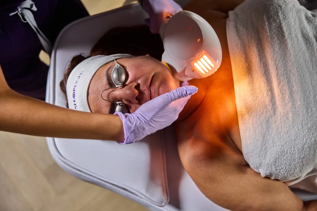 Overhead view of a facial skin tightening treatment in a SharpLight partner clinic