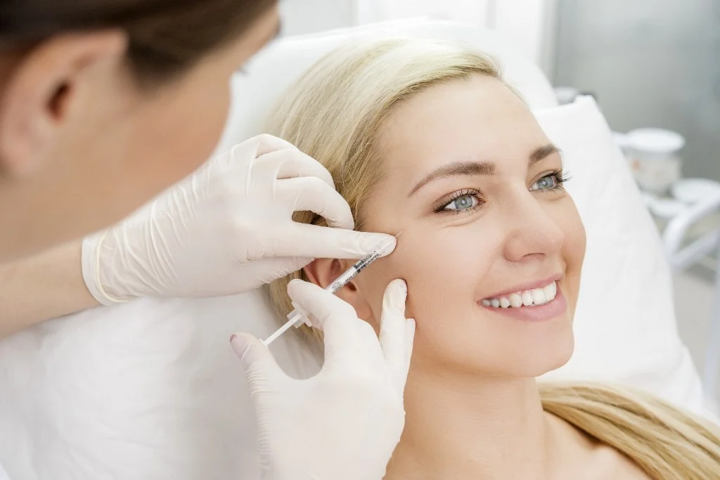 Practitioner performing a precise facial wrinkle reduction treatment